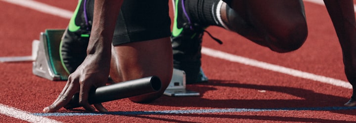 People watching a sports game on a large screen in a social setting